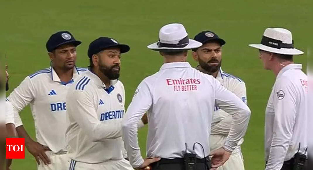 Tensions flare as Rohit Sharma, Virat Kohli engage in heated argument with umpires over bad light decision. Watch | Cricket News